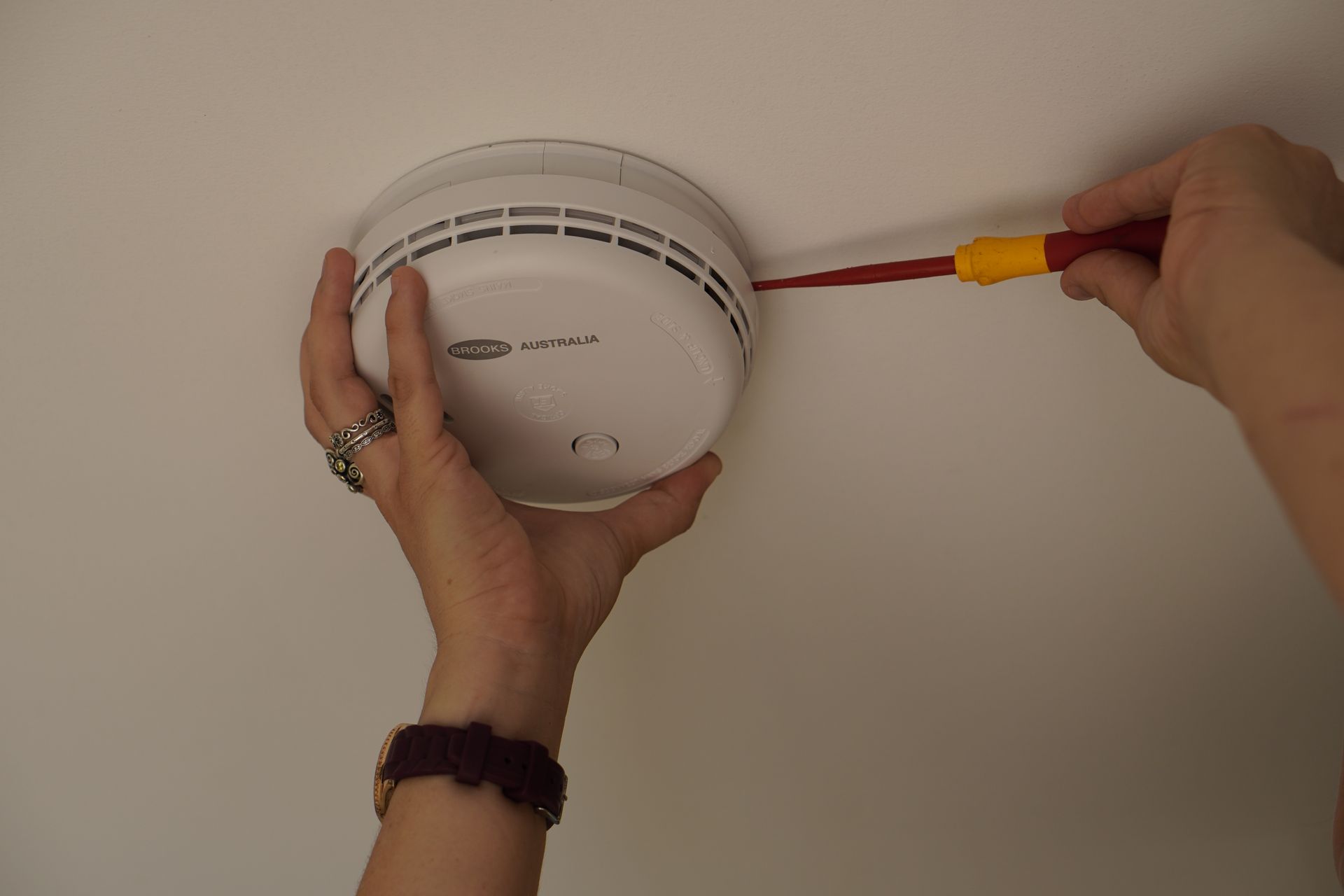 Hardwired 240V smoke alarm installation in a Sunshine Coast home.