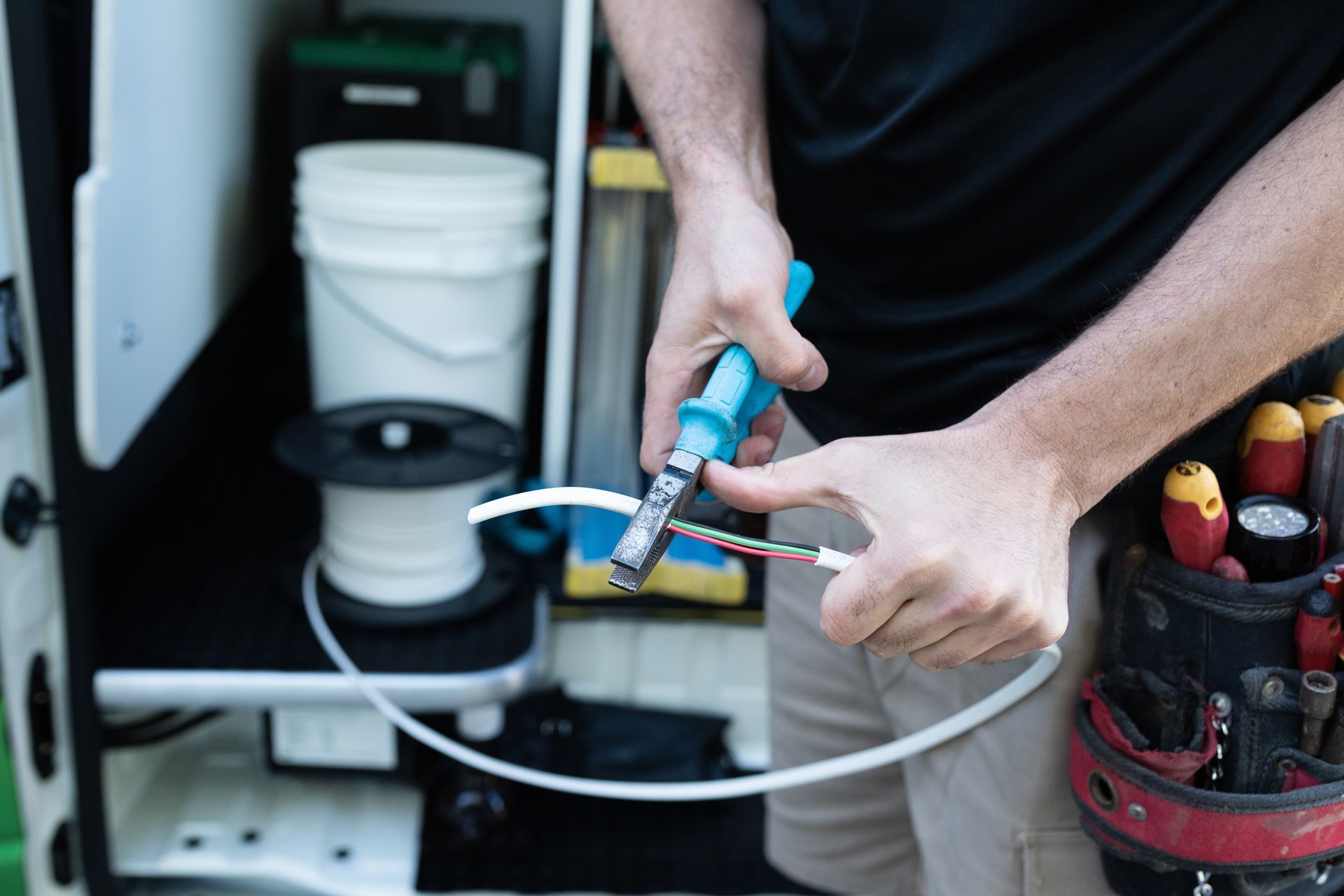 Licensed Electricians Testing and Installing Smoke Alarms