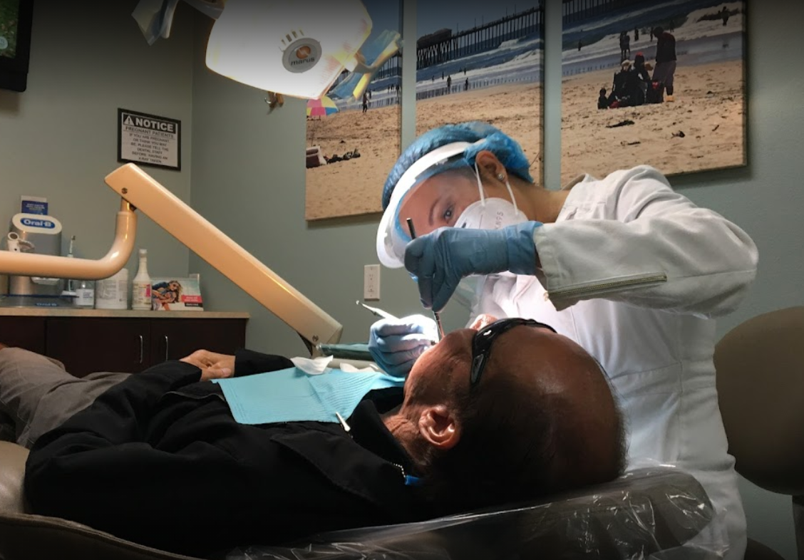 dentist preforming dental work on patient