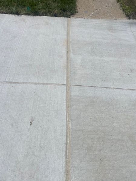 Concrete sidewalk with expansion joints.