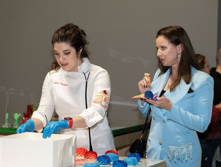 a chef boxing a cake