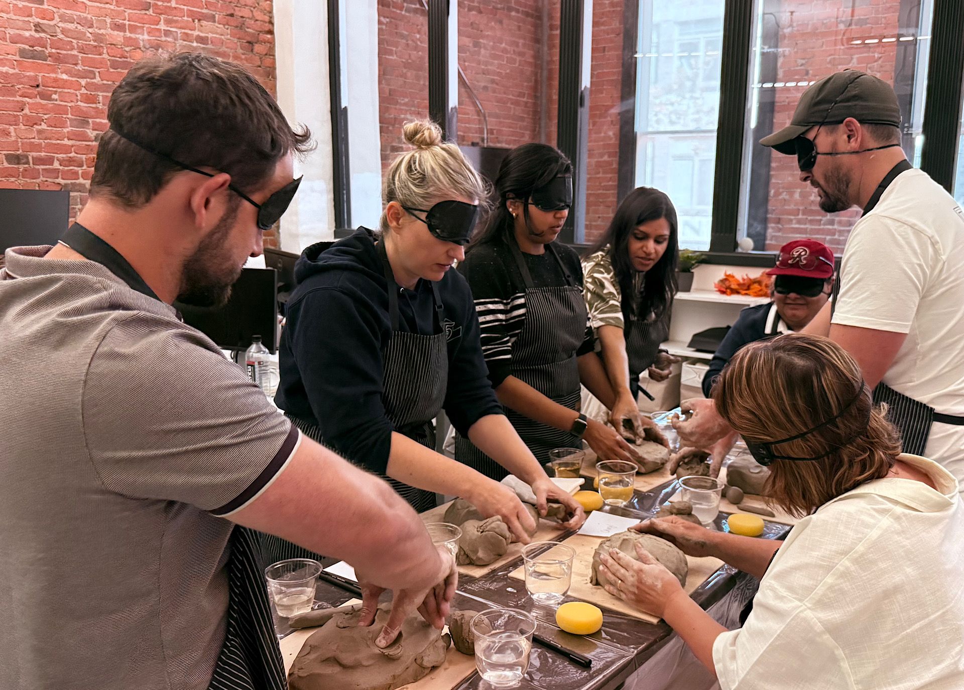 team sculpting with blindfolds on