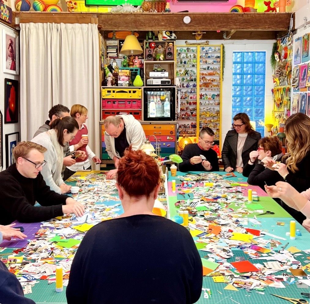 a group of people working with collage