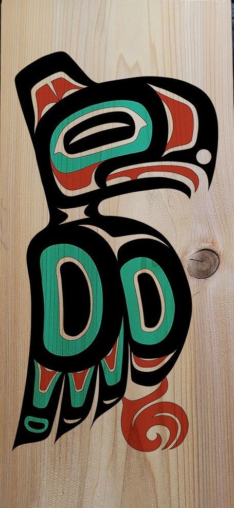 formline teal, black, and red eagle on a cedar plank