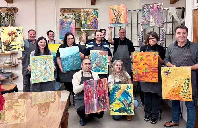 Group of People holding paintings