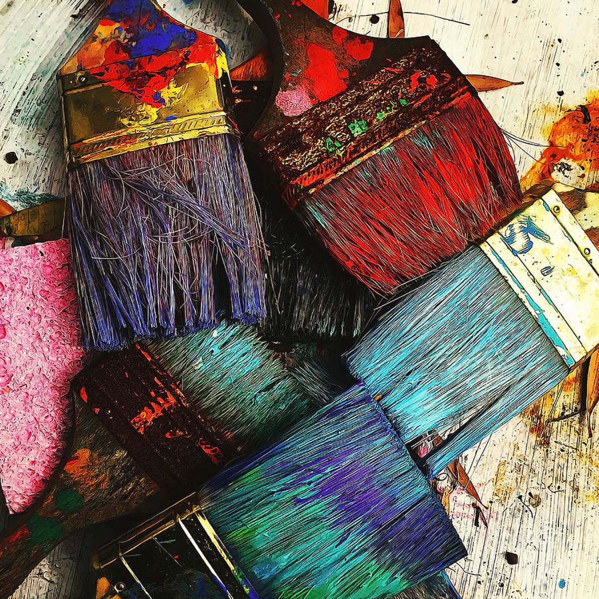 several brushes with paint on them