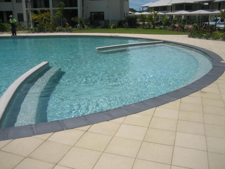 a Large Swimming Pool With Stairs Leading to It — Rockscene Pools in Bentley Park, QLD
