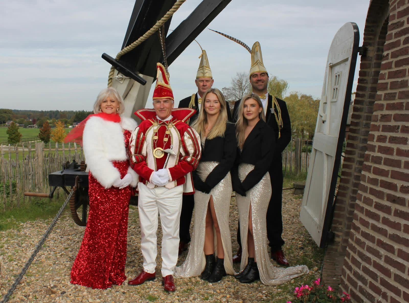 Grilling food with tongs. Bowling pins lined up, reflecting on the floor.