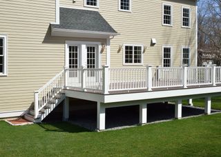 The back of a house with a deck and stairs