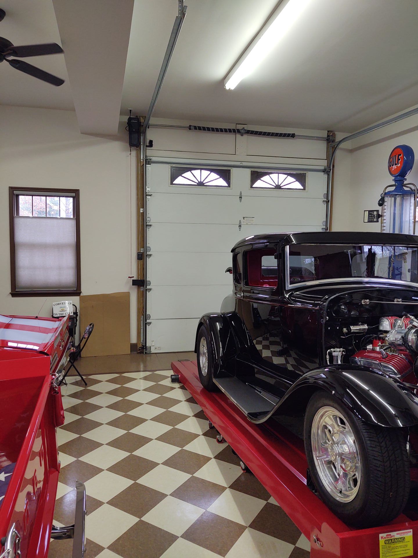 interior of garage housing old restored car