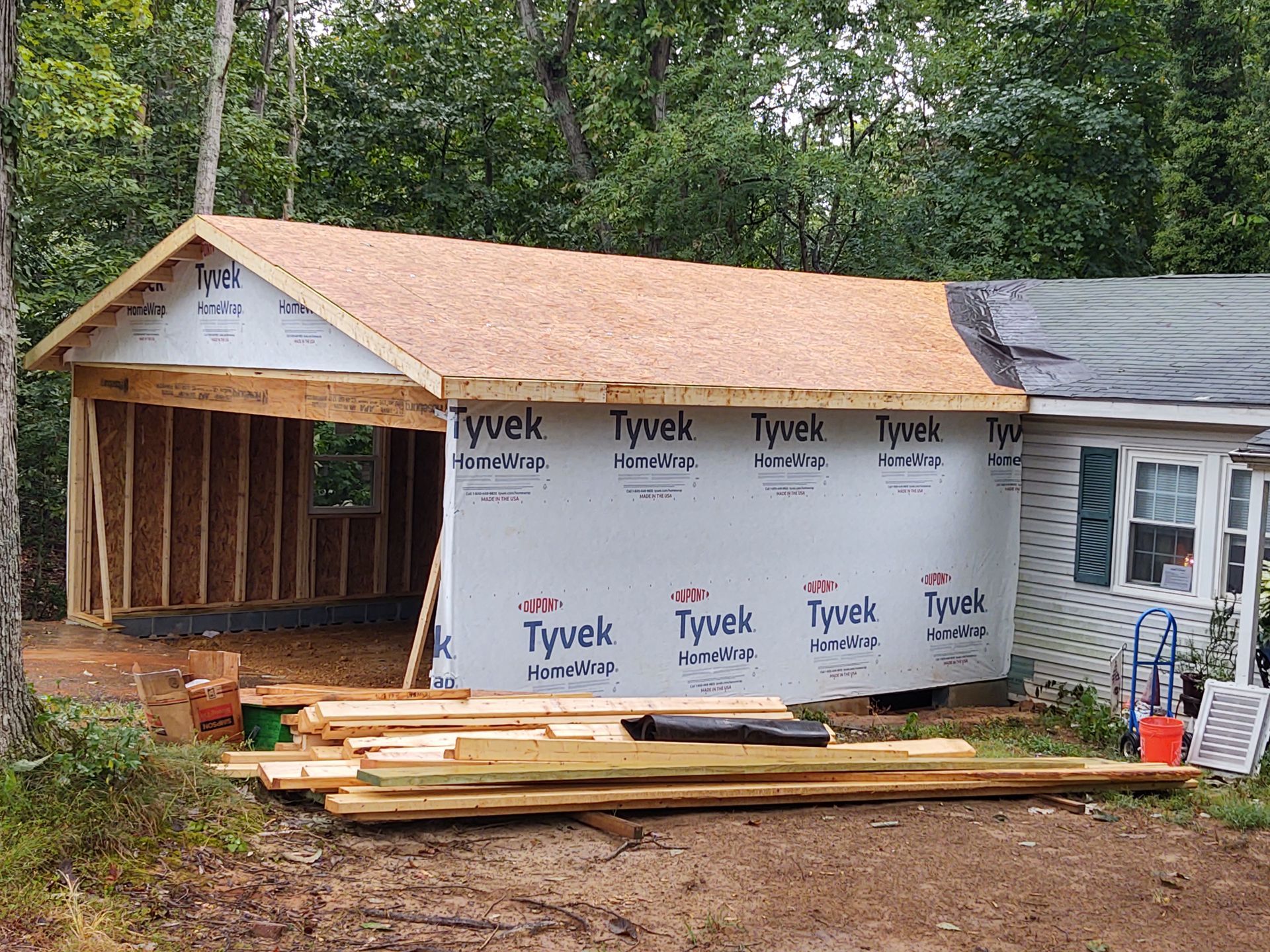 side view of garage addition showing Tyvek siding