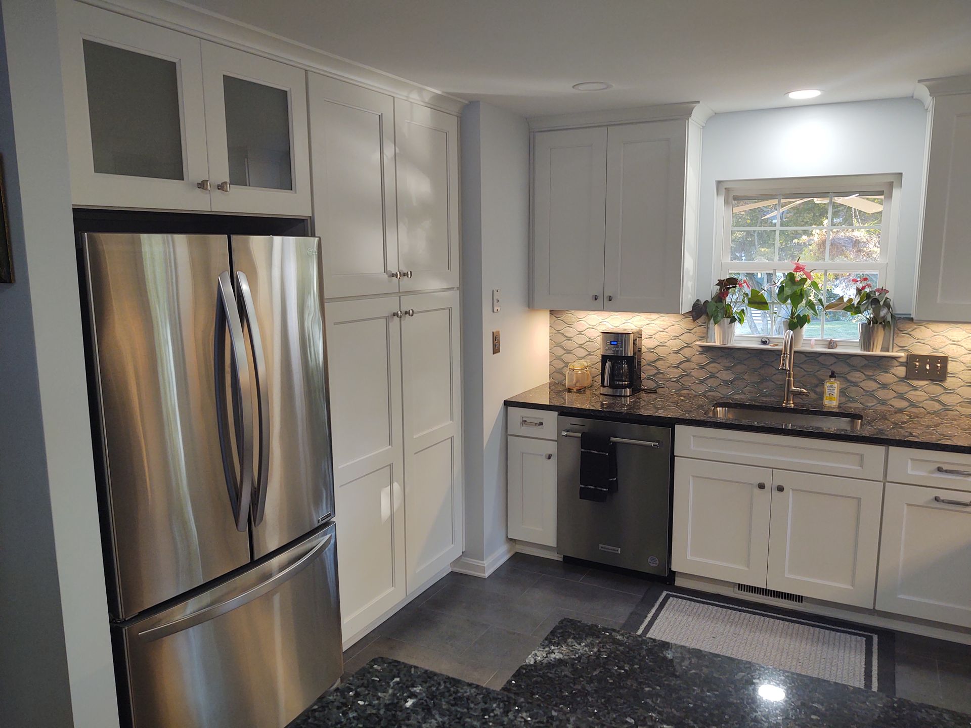 kitchen remodel white cabinetry with stainless refrigerator