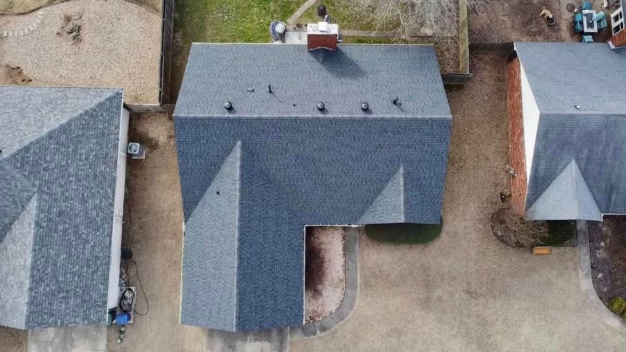 an aerial view of a house with a new roof .