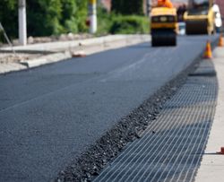 Man Spreading Asphalt - Granbury, TX - All-Star Coatings LLC