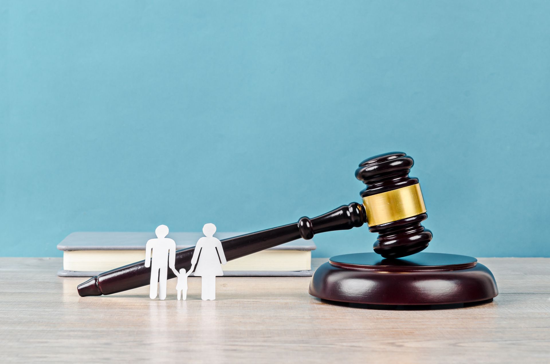 Family figure and gavel on table. Family figure and gavel on table.