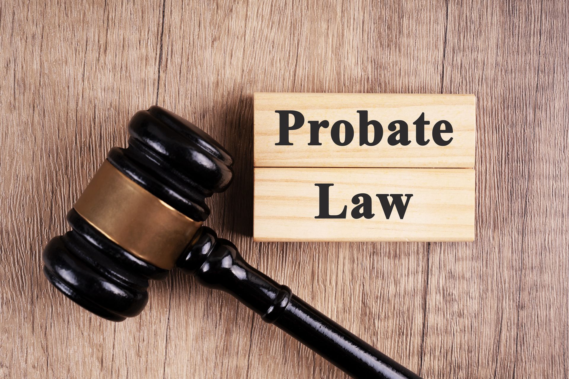 Wood blocks with text 'probate law' and gavel representing probate attorney services.