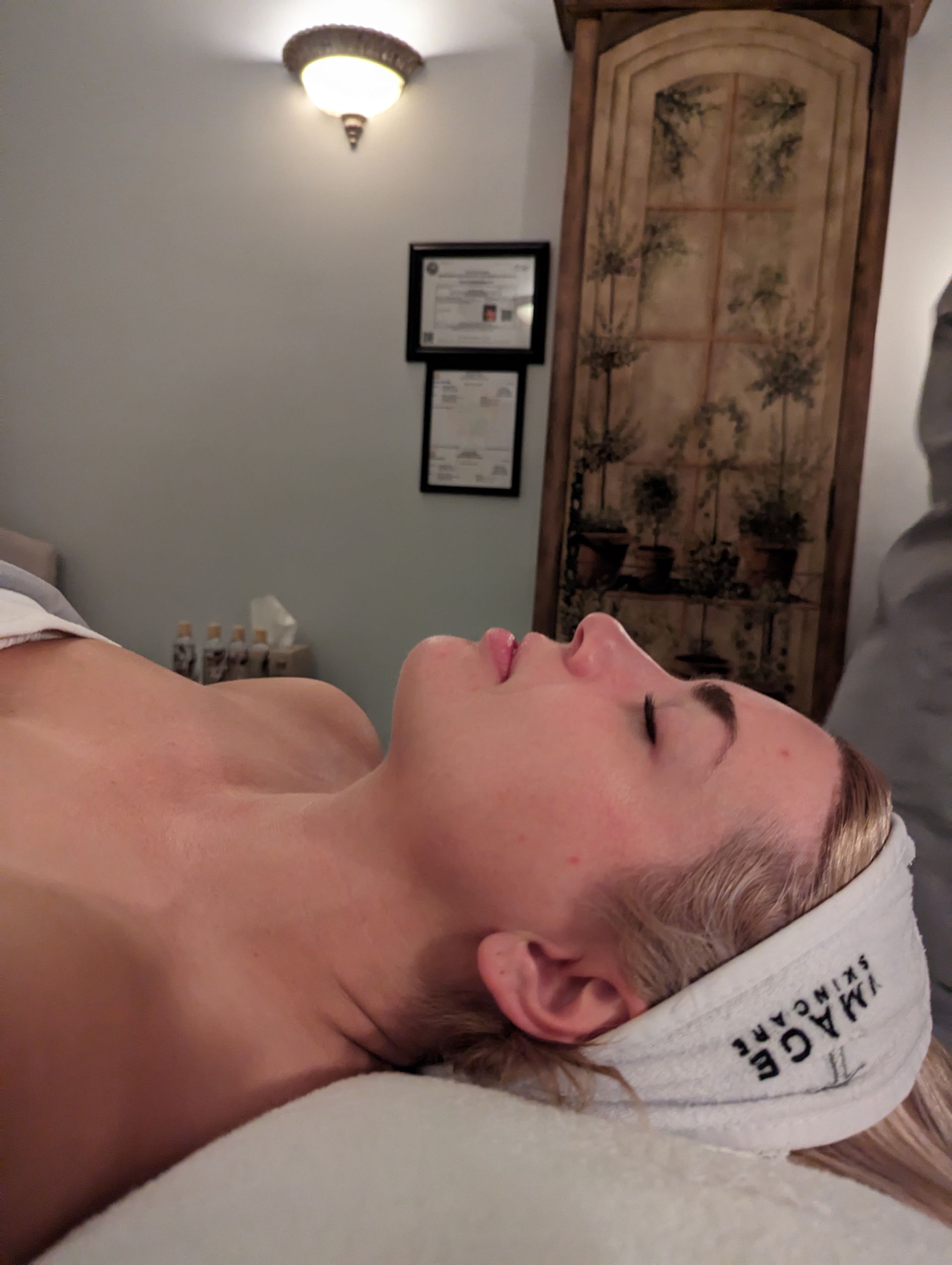 A woman wearing a headband that says image on it