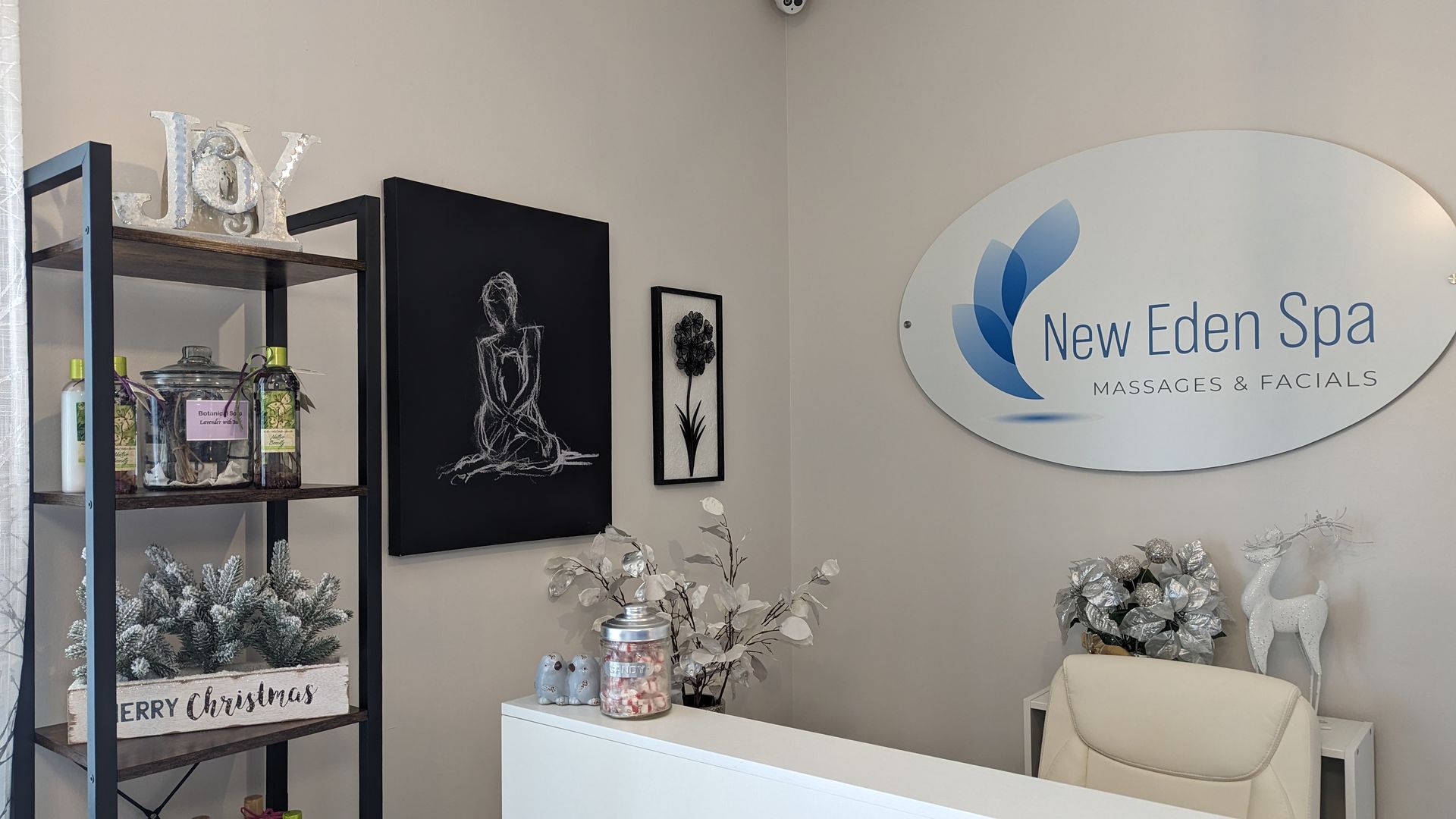 The inside of New Eden Spa with a sign on the wall.