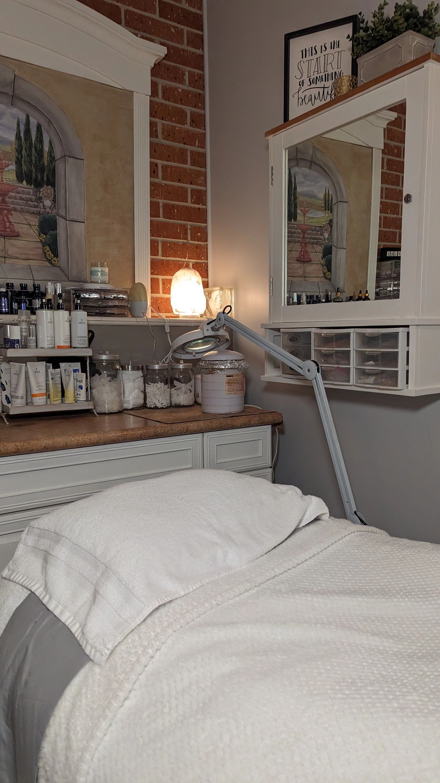 There is a bed in the middle of a room.