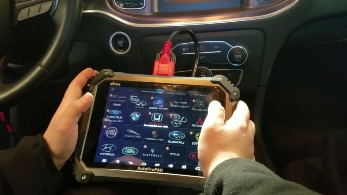 person using fob to open car