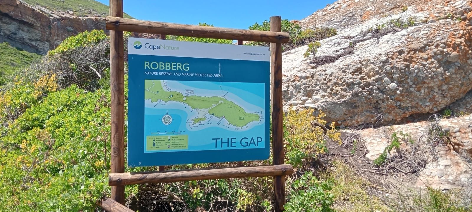 Sign with a map of the Robberg Nature Reserve, showing 