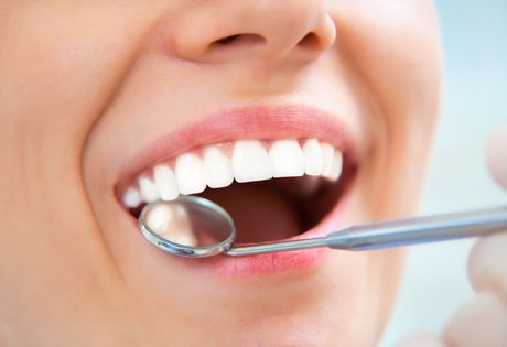 Dentist Checking Teeth — Checking Teeth After Cleaning in Havertown, PA