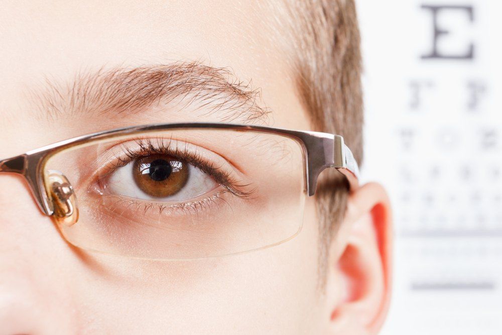 Close-up of a Person's Eye Wearing Glasses During an Eye Exam — Russell Cooper Optometrist In Rockhampton QLD