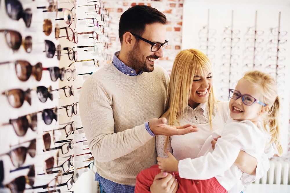 Happy Family Choosing Glasses —  Russell Cooper Optometrist In Rockhampton QLD