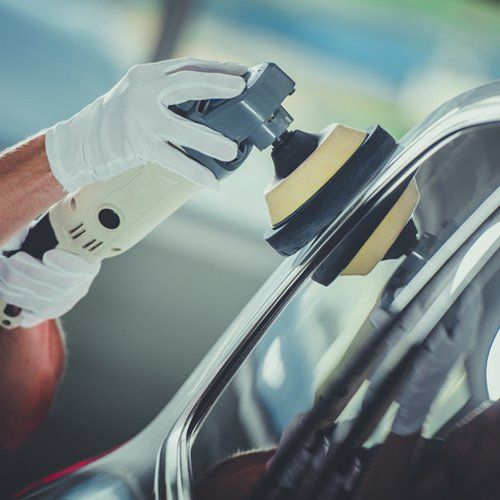 Auto body expert polishing a auto body — Port Allen, LA — Delaune’s Auto Body