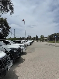 Row of white cars parked on pavement — Mt Isa Four Wheel Drive Services in Mount Isa City, QLD
