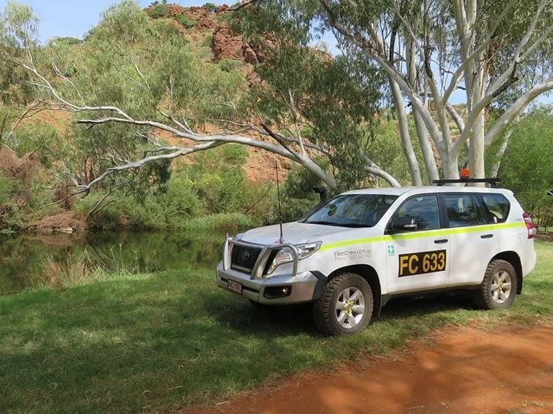 A White Toyota Prado With “fc 638” on the Side Parked — Mt Isa Four Wheel Drive Services in Mount Isa City, QLD