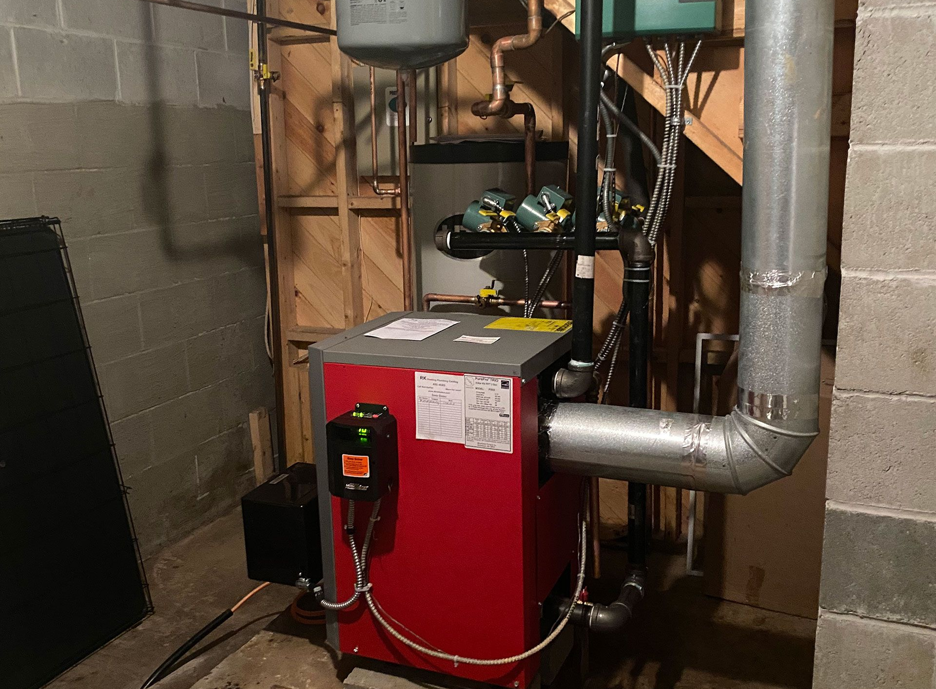 A home high energy efficient furnace in a basement 
