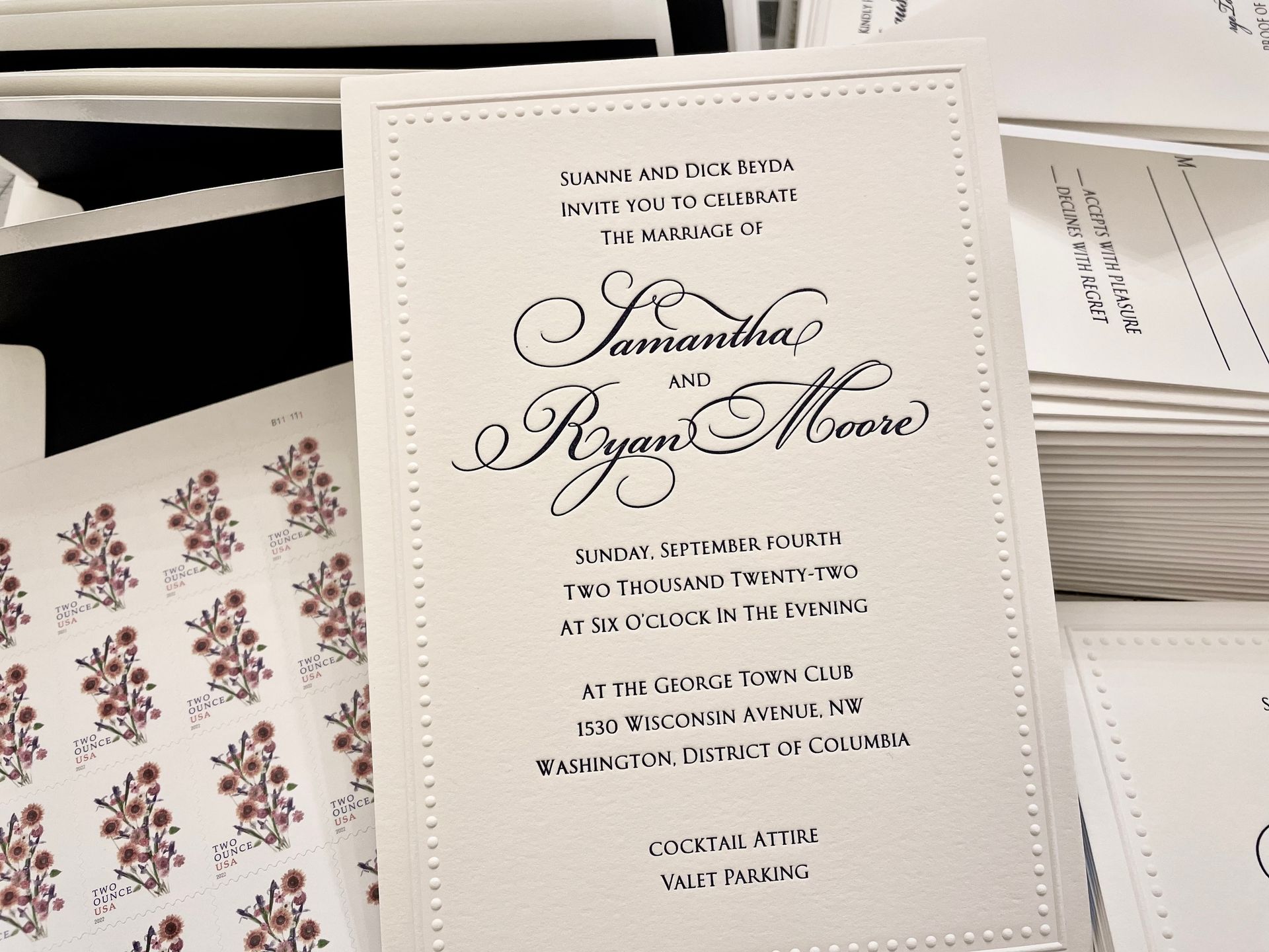 a letterpressed wedding invitation for samantha and ryan moore with blind embossed dot border