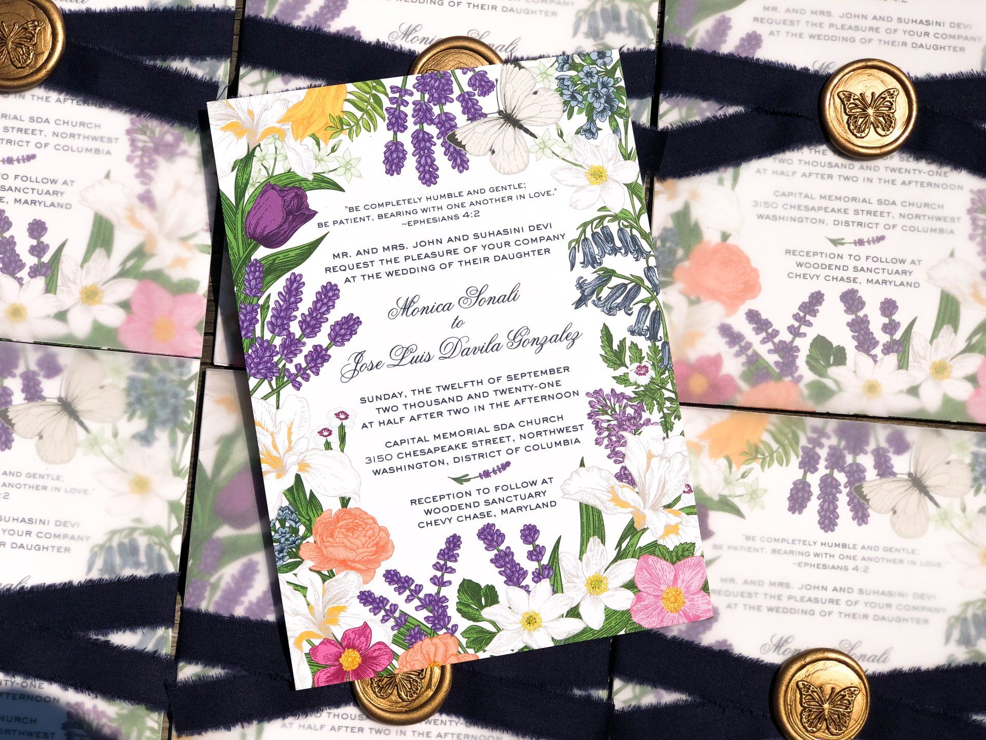 a wedding invitation inspired by a lavender spring garden with a custom floral frame and vellum wrap with silk ribbon tie and gold wax seal