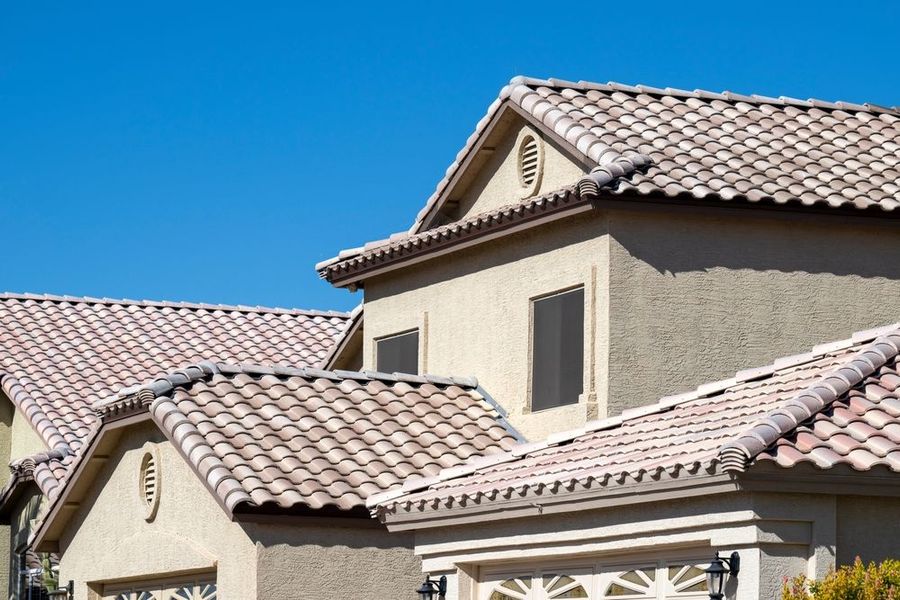 A house with a tiled roof and a garage