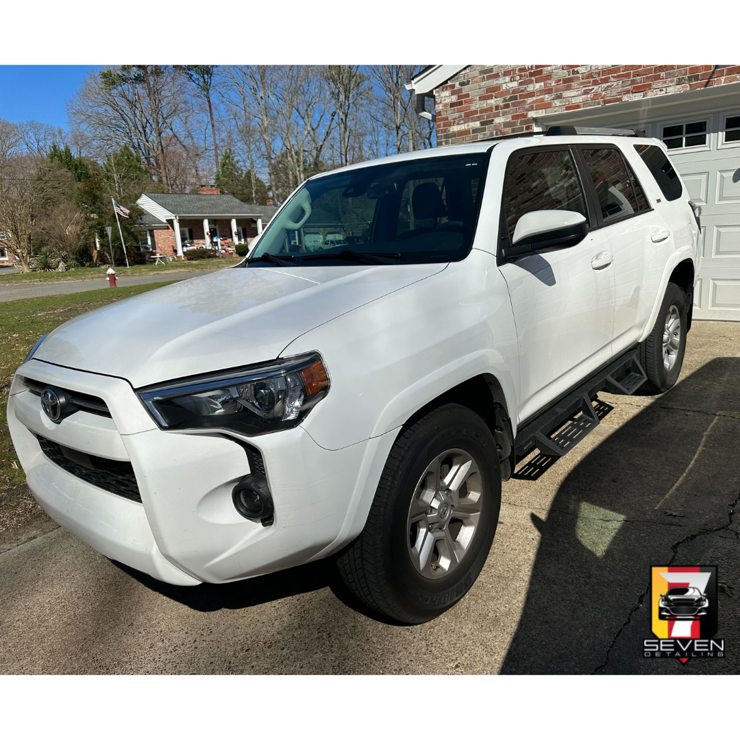 A white SUV detailed by a mobile detailing company.