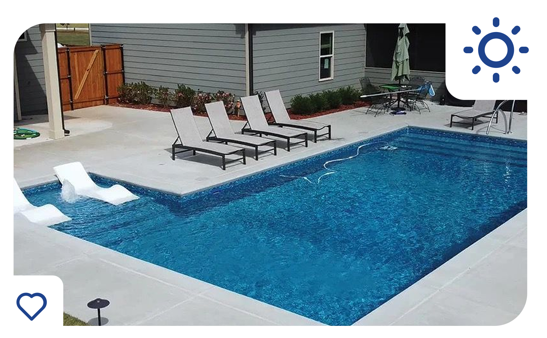 Pool with lounge chairs and steps in a backyard setting.