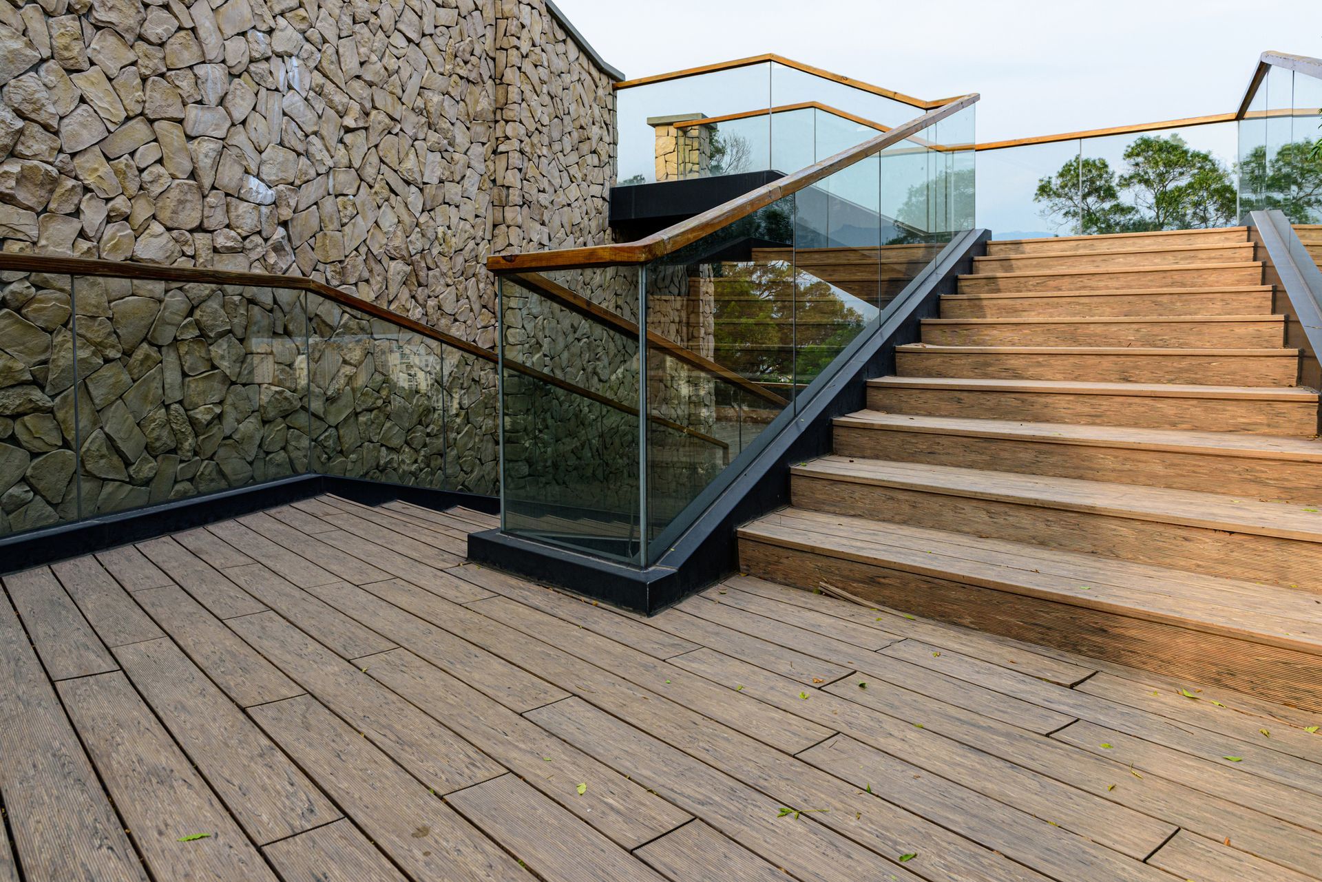 Glass Guardrails in Exterior Stairs with Wooden Floor