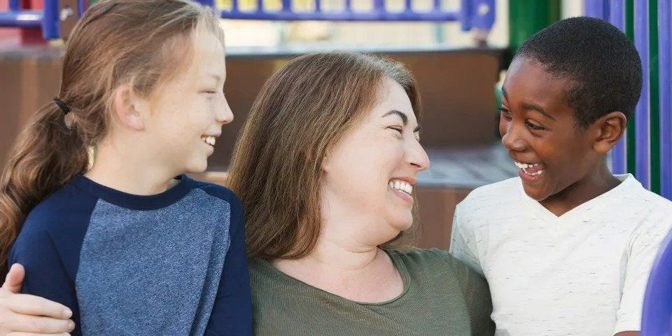 Laughing Woman and Children – Anchorage, AK – Counseling Solutions of Alaksa LLC