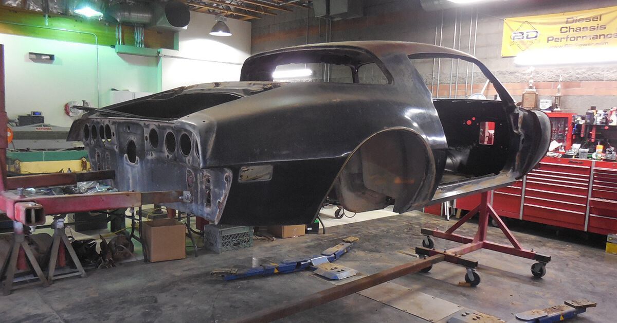 A car that is being built in a garage