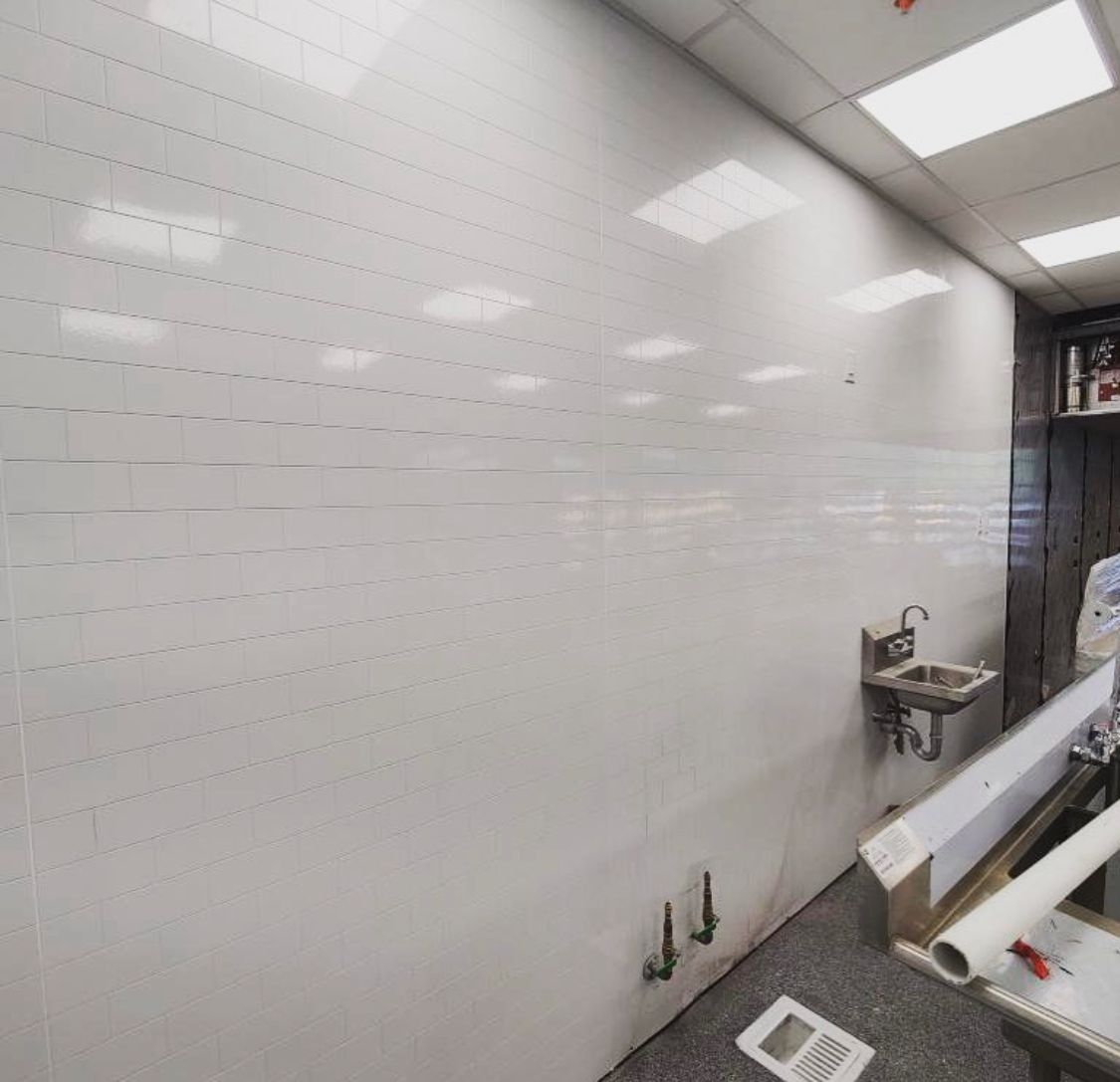 Worker Doing Something for Wall Protection