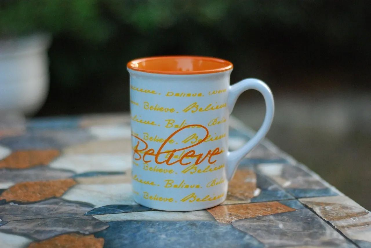 White mug with orange rim and 