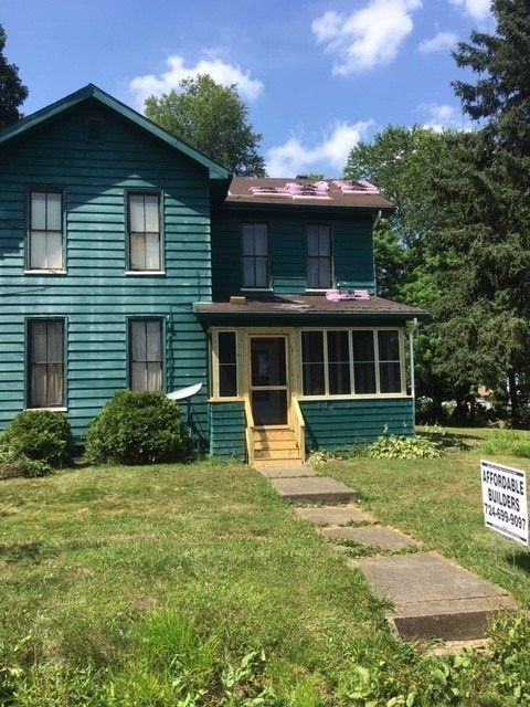 Siding and Roofing Before Photo  — Clean Roof Gutter in Sharpsville, PA
