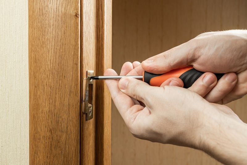 Handyman fixing or repairing apartment — Locksmith in Southport, QLD