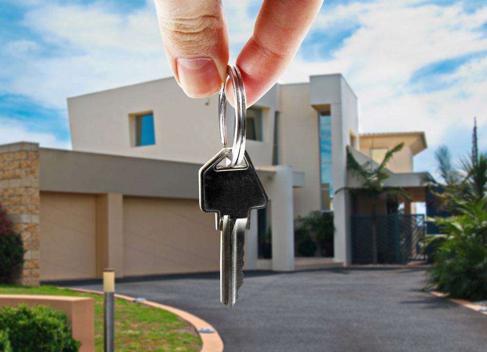 Key in hand with real estate — Locksmith in Clear Island Waters, QLD