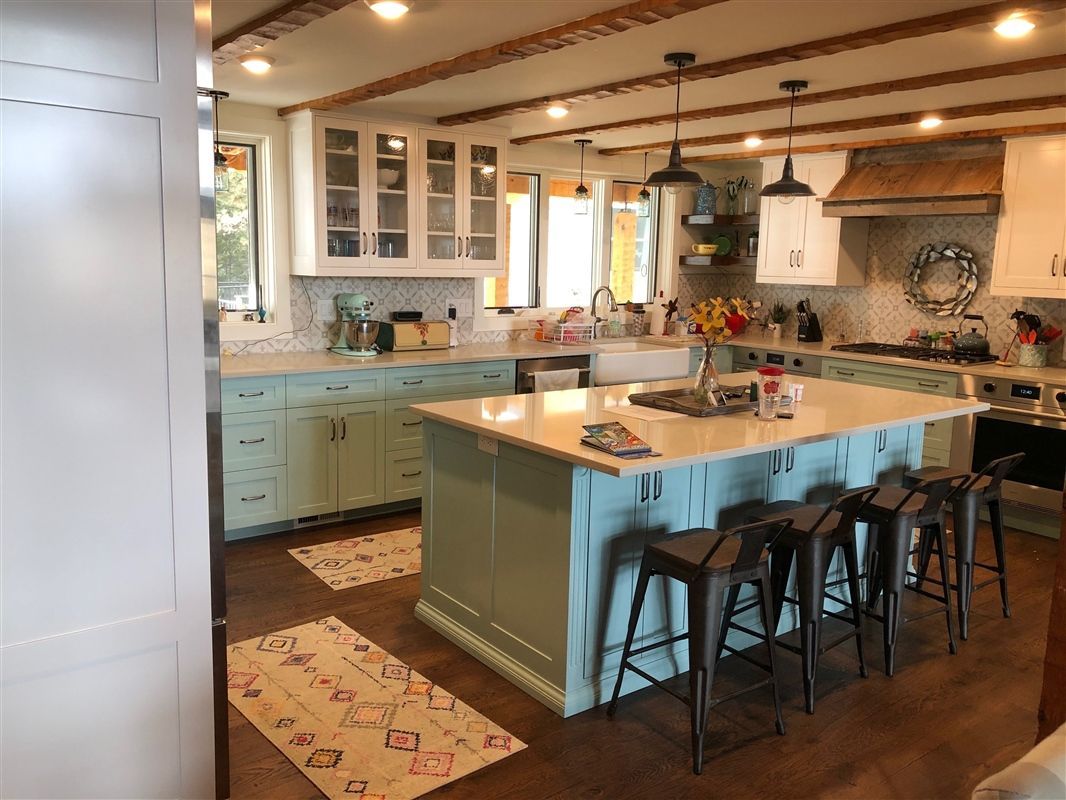A kitchen with a large island in the middle of it.