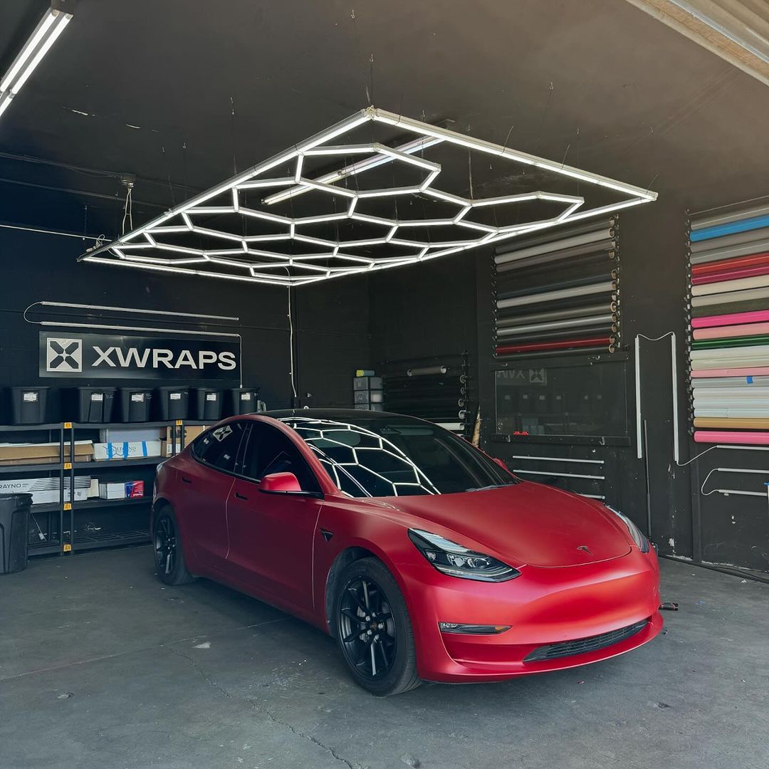 Tesla Model 3 with custom car wraps and geometric roof design at XWRAPS studio, showcasing premium automotive customization