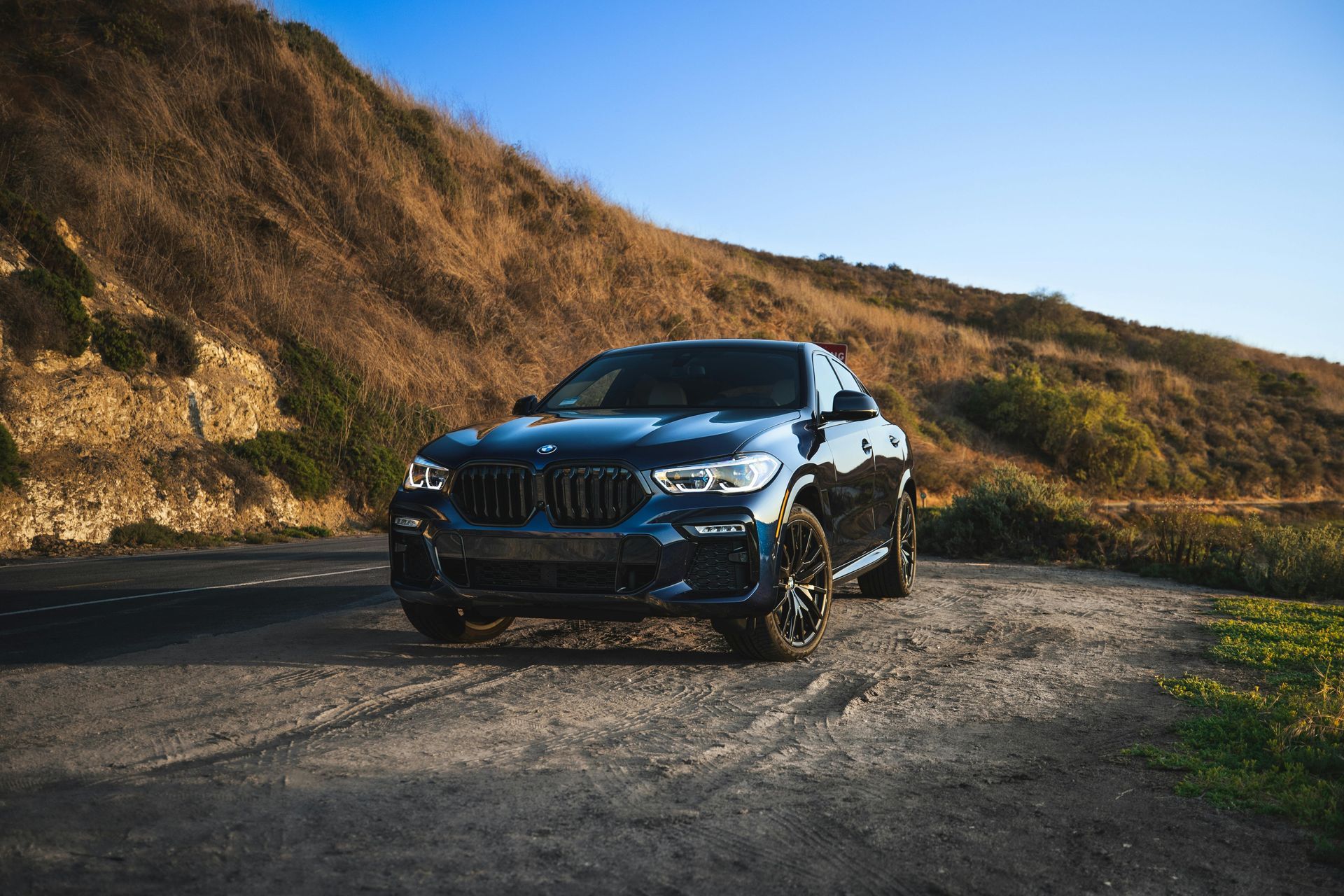 A BMW with tinted windows that follow car tinting laws in California.  
