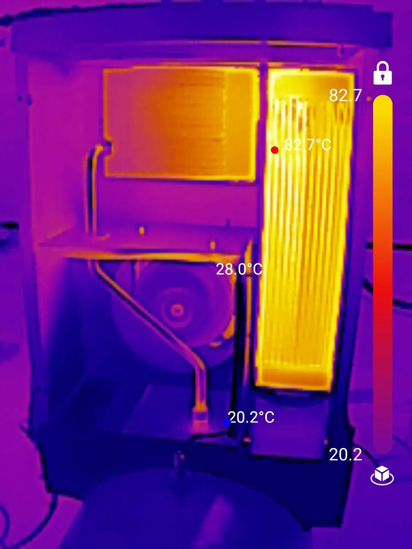 Thermal image of a machine's interior with temperature readings. Yellow and orange indicate heat, cooler parts are blue.