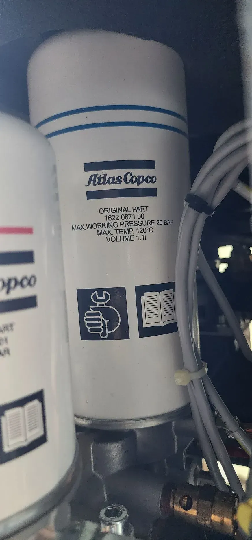 White Atlas Copco filter cartridge with blue stripes and printed text.